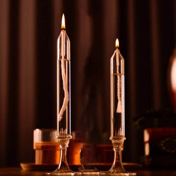 Two glass test tubes with lit candles inside, showcasing a science experiment setup for educational demonstrations.
