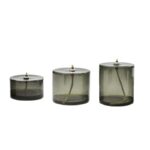 Set of three vintage-style oil lamps with glass containers and metal tops, perfect for science-themed decor or educational displays.