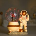 Electrostatic Tesla Coil and Astronaut Figurine Display.
