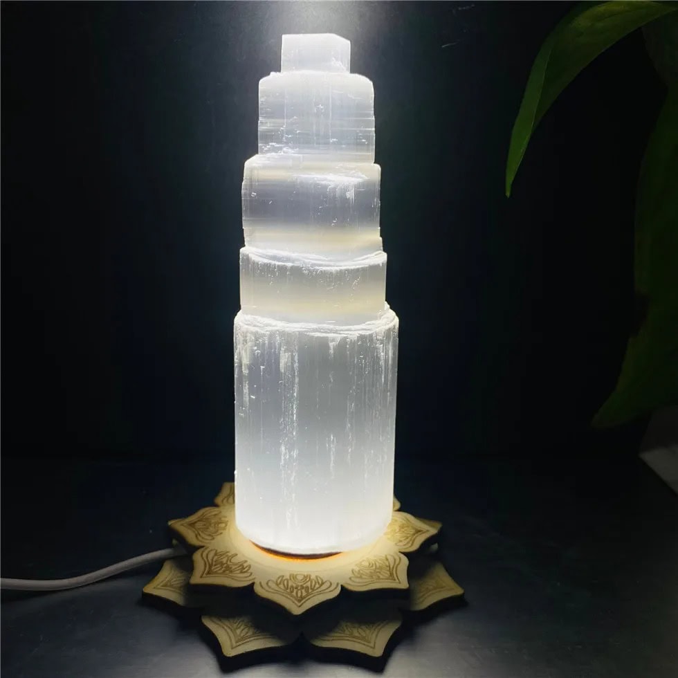 Salt Lamp Tower with Wooden Base Salt lamp tower with a wooden base, illuminated to showcase its natural crystalline structure. Perfect for science decor and educational settings.