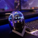Modern desk lamp featuring a water-filled transparent dome with LED lighting, perfect for tech enthusiasts and science decor enthusiasts.