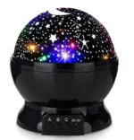 A starry sky projector displaying colorful stars and moon patterns on the ceiling, perfect for creating a relaxing ambiance in bedrooms or classrooms.