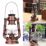 Antique copper lantern with glass chimney, perfect for vintage decor and ambient lighting.