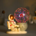 Astronaut and plasma ball science decor piece.