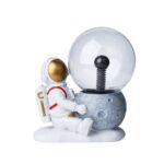 Astronaut and Moon Lamp Decor for Science Enthusiasts.