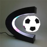 LED soccer ball moon lamp with a black crescent-shaped stand.