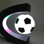 Modern soccer ball LED lamp hanging from a black moon-shaped frame, ideal for sports-themed decor and educational spaces.
