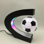Modern soccer ball night light with moon-shaped base featuring colorful LED lights, perfect for kids' rooms or sports-themed decor.