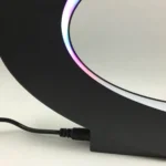 Modern black desk lamp featuring customizable RGB lighting and sleek design, ideal for study or workspace illumination.