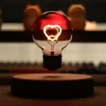 Neon heart-shaped light inside a transparent glass bulb, creating a romantic and modern science-inspired decor piece. Perfect for educational spaces, home decor, or science-themed gifts.