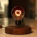 Decorative LED light bulb with a heart-shaped filament, mounted on a wooden base, creating a warm and romantic ambiance.