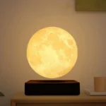 A realistic moon lamp night light with detailed lunar surface texture, emitting a warm yellow glow. Perfect for bedroom decor, educational purposes, or as a unique gift.