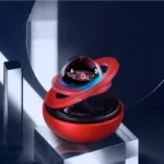 Futuristic planetary model with a transparent sphere and red base, showcasing a space-themed decorative piece.