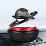 Futuristic planetary model with a black base, red ring, and a transparent sphere representing a planet with surface details, set on a sleek surface.