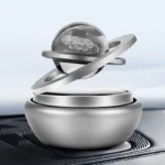 Futuristic science model with a floating glass sphere and metallic rings, showcasing innovative scientific design.
