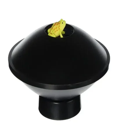 Magnetic frog toy inside a black dome, educational science gadget for kids and students.