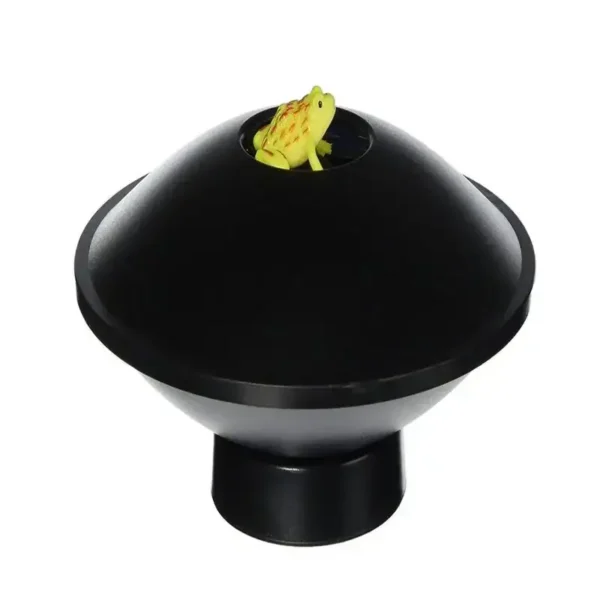 Magnetic frog toy inside a black dome, educational science gadget for kids and students.