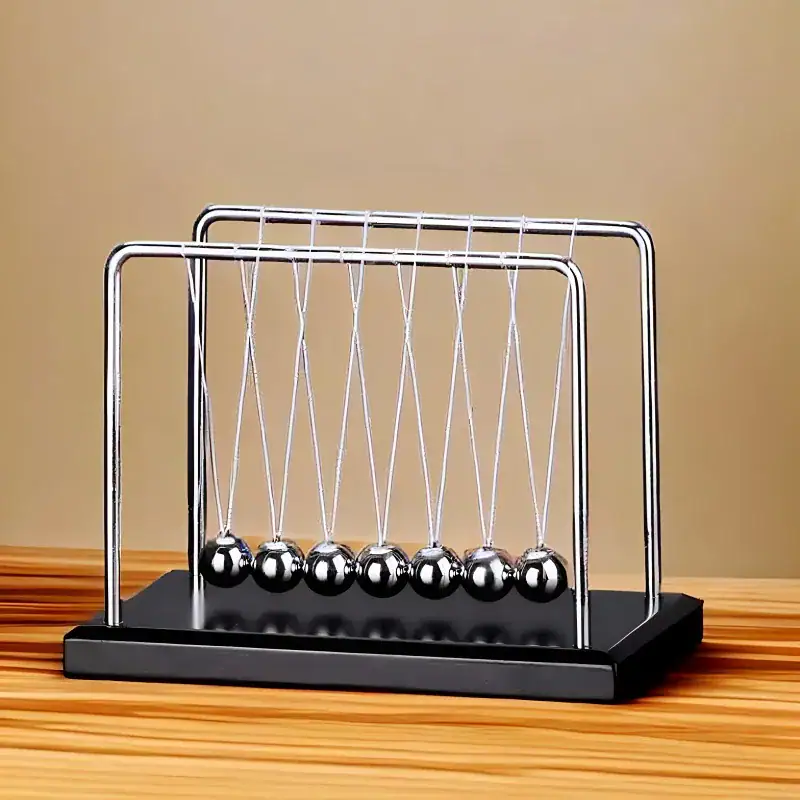 Newton's Cradle - Desktop Physics Toy Newton's Cradle desktop physics toy with metal balls and a black base, demonstrating conservation of momentum and energy.