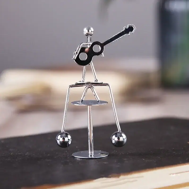 Miniature Metal Guitar Figurine for Science Decor and Educational Toys Small metallic guitar figurine made of shiny metal, perfect for science-themed decor or educational toy displays.