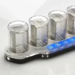 Laboratory test tube holder with four transparent test tubes on a white background.