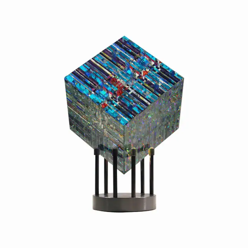 Futuristic Geometric Art Sculpture Modern geometric sculpture with vibrant blue and multicolored patterns on a black stand, perfect for science decor and educational display.