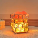 Bright orange lava lamp with glass cubes and bubbling wax inside, creating a mesmerizing glow. Perfect for science-themed decor and educational purposes.
