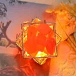 A decorative glass lamp featuring glowing orange geode crystals illuminated from within, creating a warm and enchanting ambiance. Perfect for science-themed decor or educational displays.