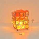 Illuminated Rubik's Cube lamp with a glowing orange light, perfect for science decor and educational spaces. Measures 12cm in height and 12cm in width, adding a vibrant touch to any room.
