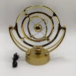 Gyroscope toy with a gold finish, demonstrating rotational physics principles.