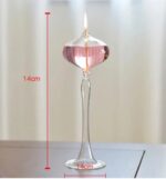 Elegant glass candle holder with a lit candle, measuring 14cm tall, perfect for science-themed decor or educational displays.