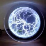 Lightning ball plasma globe with vivid electrical discharges inside a glass sphere, showcasing dynamic lightning effects.