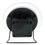 Battery-operated LED light with a black base and a transparent circular cover.