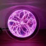 Illuminated electric lightning ball displaying vibrant purple lightning patterns inside a glass sphere, creating a captivating visual effect.