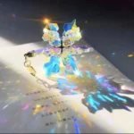 Vibrant crystal butterfly keychain casting colorful light reflections on paper.