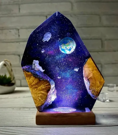 Decorative LED lamp featuring a cosmic space scene with planets, stars, and an astronaut, perfect for science decor and educational purposes.