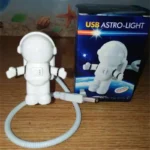 Cute astronaut USB LED light with flexible arm, ideal for space-themed decor and educational purposes, powered via USB connection.