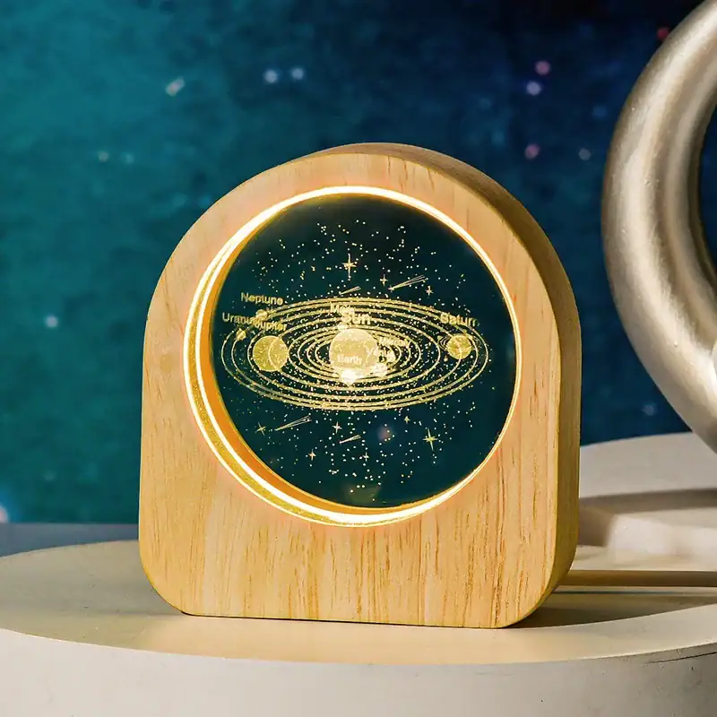 Solar System LED Night Light LED night light featuring a detailed solar system model with planets and orbit paths.