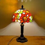 Vibrant stained glass lamp featuring a floral design, perfect for enhancing home interiors or as an educational science gadget.