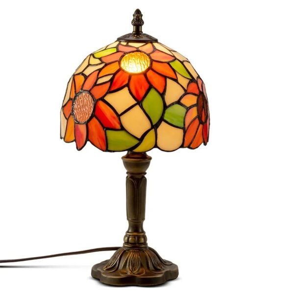 Elegant Tiffany-style floral table lamp with stained glass shade featuring vibrant orange, yellow, and green flower patterns, perfect for home decor and educational science displays.