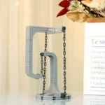 Clever LEGO-style science experiment stand with chains and hooks for educational demonstrations.