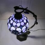 Decorative mosaic glass table lamp featuring a vibrant, multicolored stained glass design illuminated by energy-efficient LED lights. Perfect for adding a touch of artistic elegance to any space.
