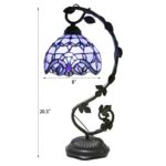 Elegant Tiffany-style stained glass desk lamp featuring a colorful floral pattern and adjustable arm for versatile lighting. Ideal for home decor and reading nooks.