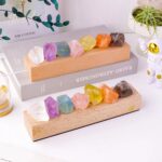 Bright mineral specimens arranged on wooden bases for science learning and decor.