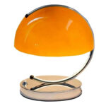 Orange desk lamp with a sleek, modern aesthetic and curved shape for stylish lighting. Perfect for science-themed decor or educational spaces.