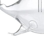 Glass whale sculpture, transparent and detailed, ideal for science-themed decor and educational toys.