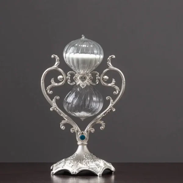 A beautifully crafted silver goblet featuring elaborate scrollwork and a polished finish, perfect for decorative purposes or as a collectible item.