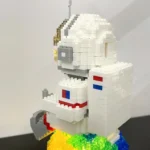 Detailed LEGO model of a space shuttle with white, gray, red, and blue bricks, showcasing intricate design and craftsmanship.