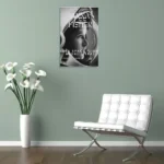 Vintage NASA space flight model 1984 poster featuring a woman's profile in black and white, displayed on a light green wall.