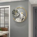Unique space-themed wall clock with astronaut and moon design, perfect for science enthusiasts and educational decor.
