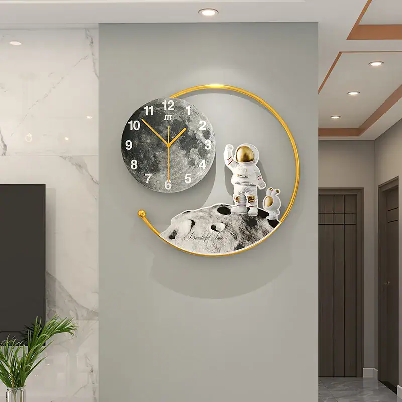 Space Exploration Wall Clock with Astronaut and Moon Design Modern wall clock featuring an astronaut figure on the moon with a black and white moon face and a gold circular frame, perfect for science-themed decor.